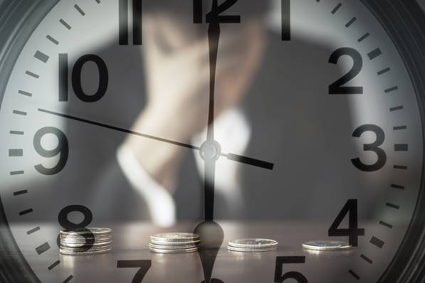 Man looking at clock